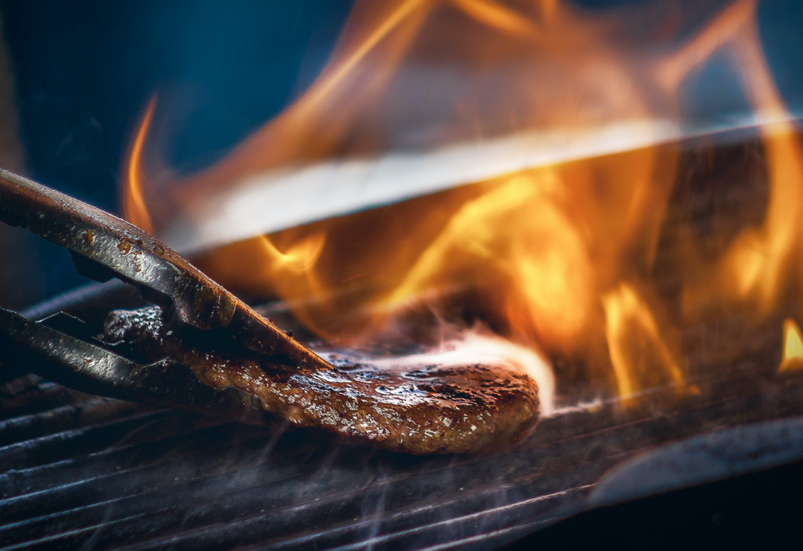 Steak is being flame grilled in our steakhouse restaurant.